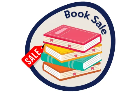 A stack of books with a sale sticker