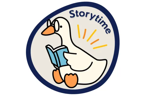 A goose with glasses reading a book